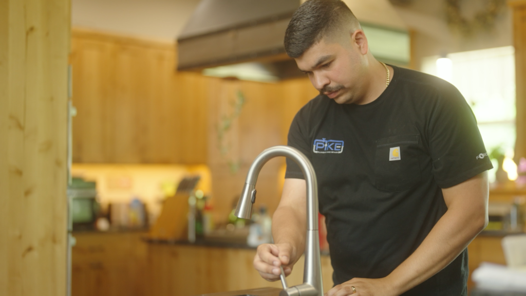 Image of Anthony turning on water