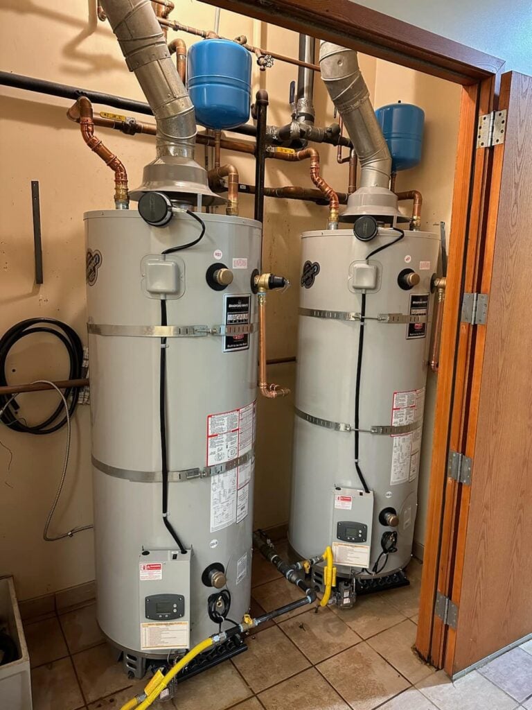 Plumbing services van by Pike Plumbing & Sewer, showcasing water heater installations and repairs in Auburn, WA.