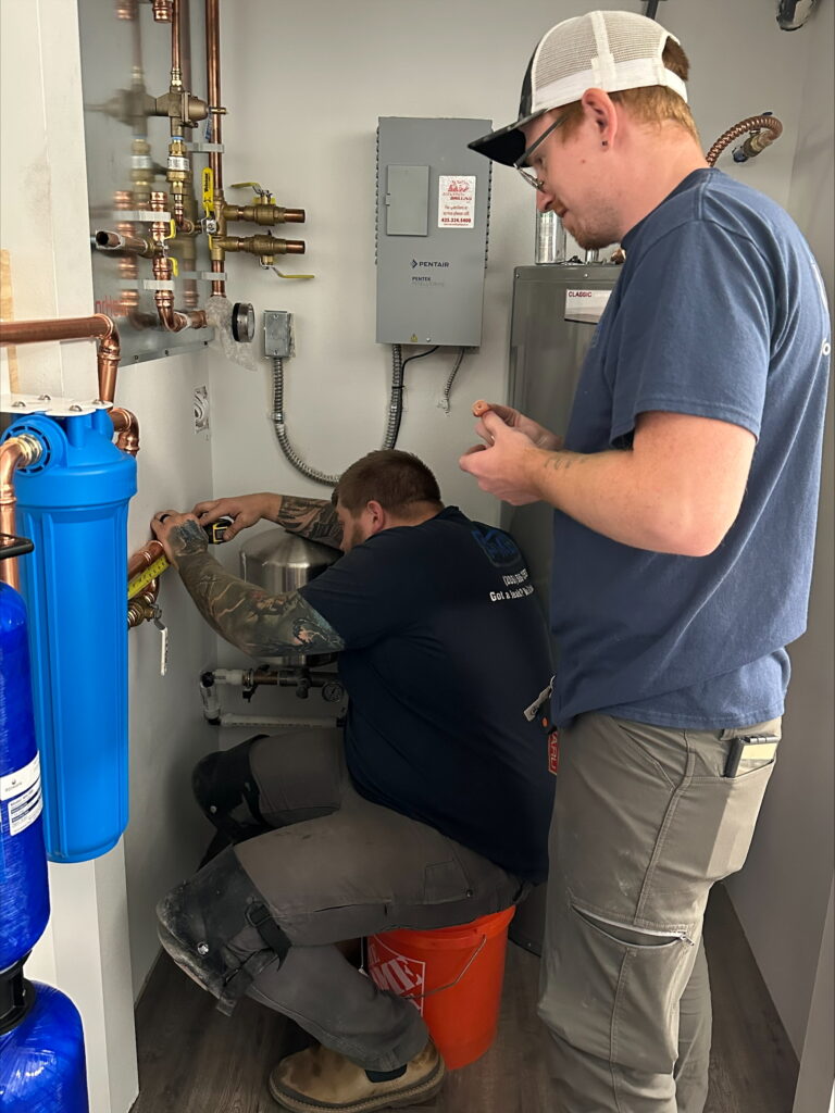 Pike Plumbing & Sewer team fixing plumbing in Seattle