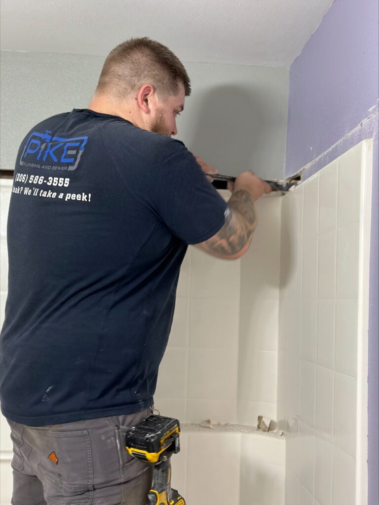 Pike Plumbing & Sewer working on bathroom plumbing
