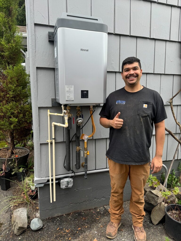 Tankless water heater installation outside by Pike Plumbing & Sewer